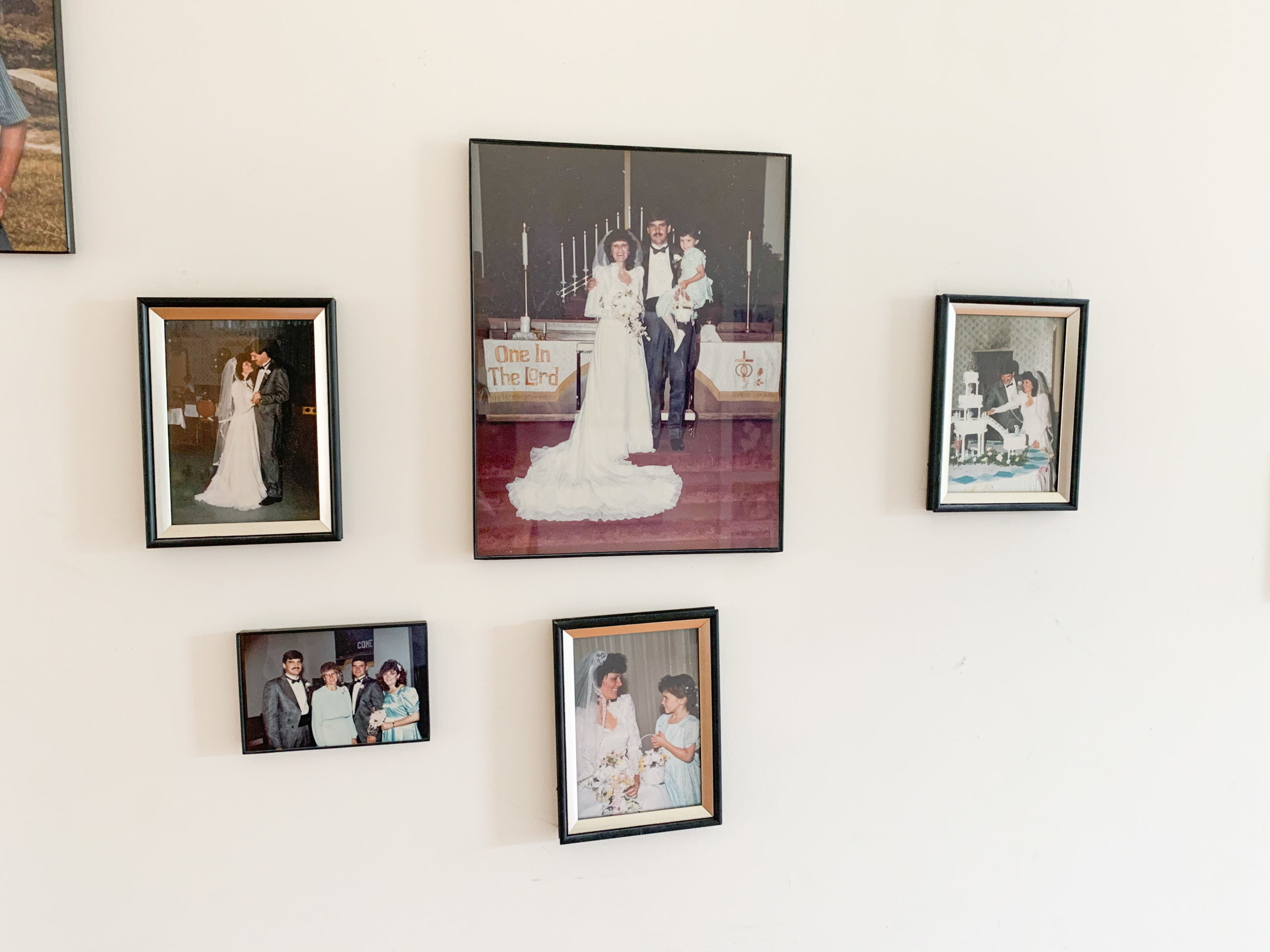 wedding photos printed on the walls of a house