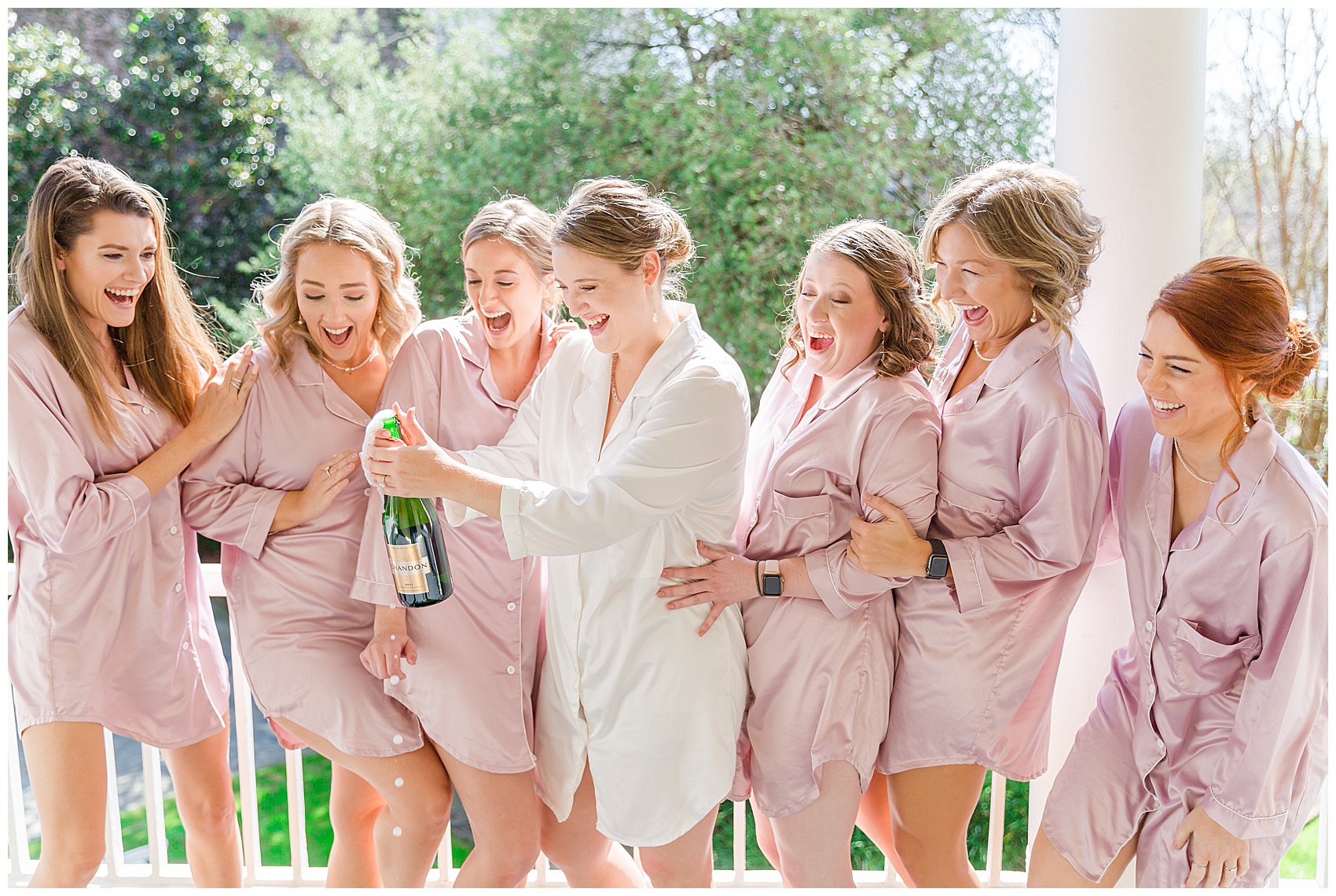 Spring Charleston Wedding at The William Aiken House popping champagne
