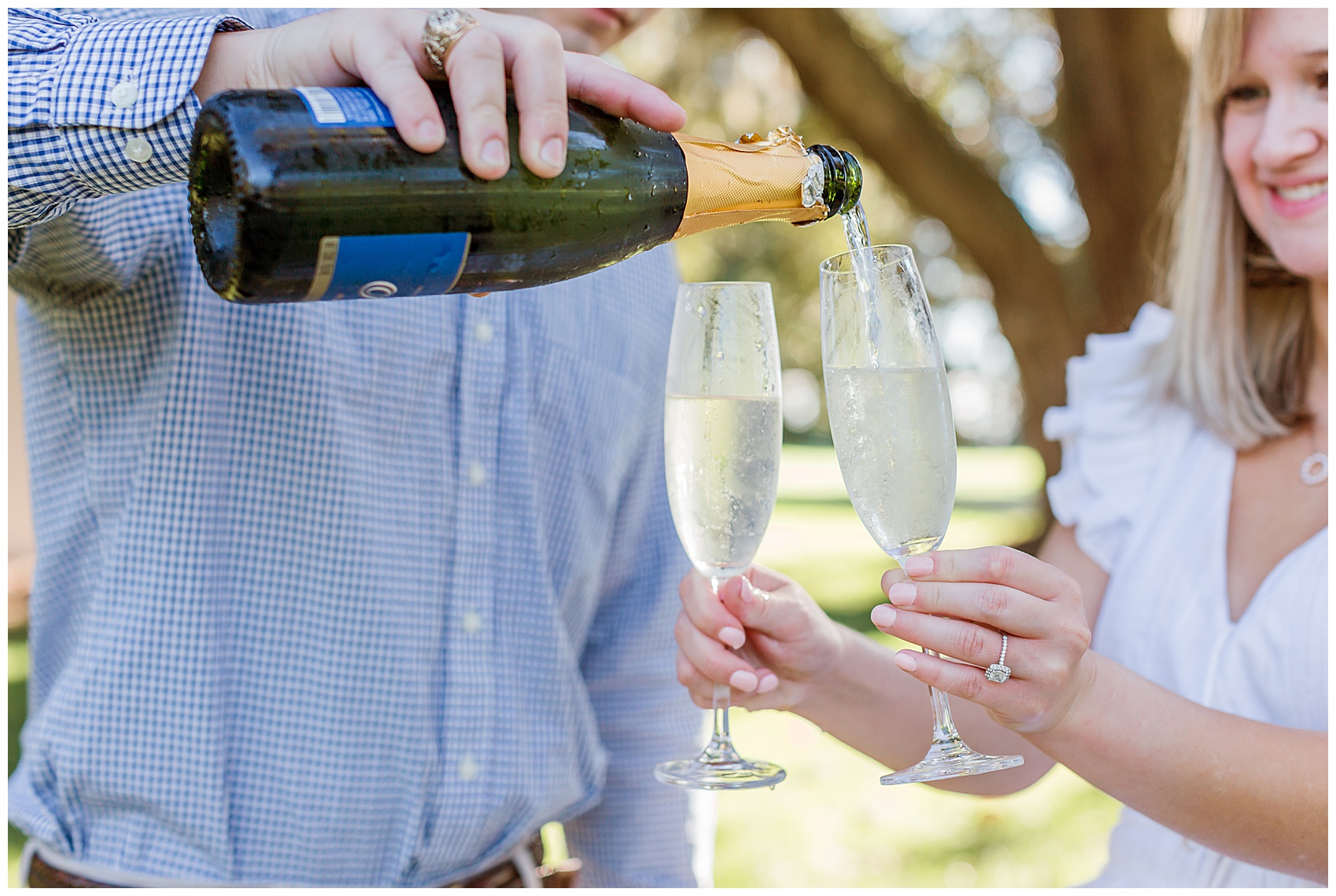 Charleston wedding photographer capturing an engagement session in the lowcountry and popping champagne