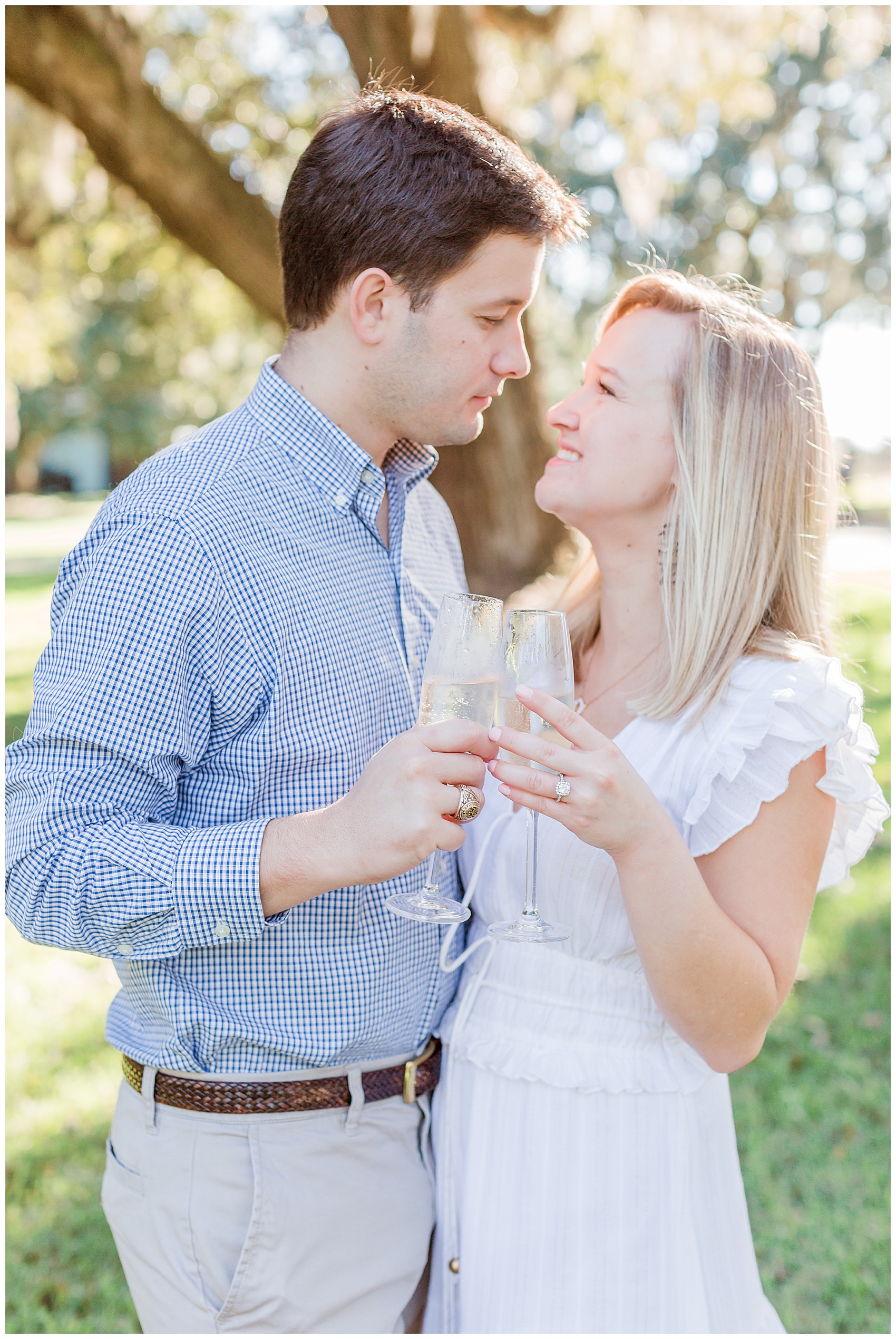 Charleston wedding photographer capturing an engagement session in the lowcountry with champagne