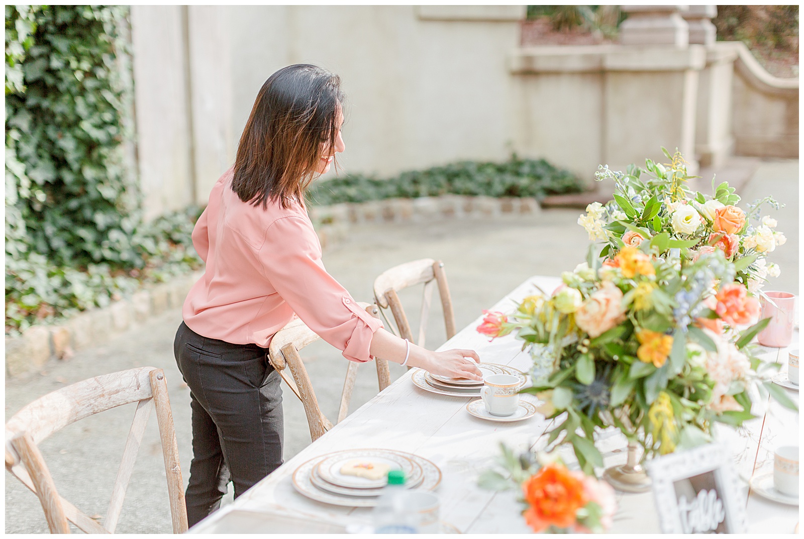 How to sleep well the night before your wedding | wedding planner decorating a reception table at the swan house